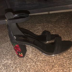 Black open toed heels with floral design on heels